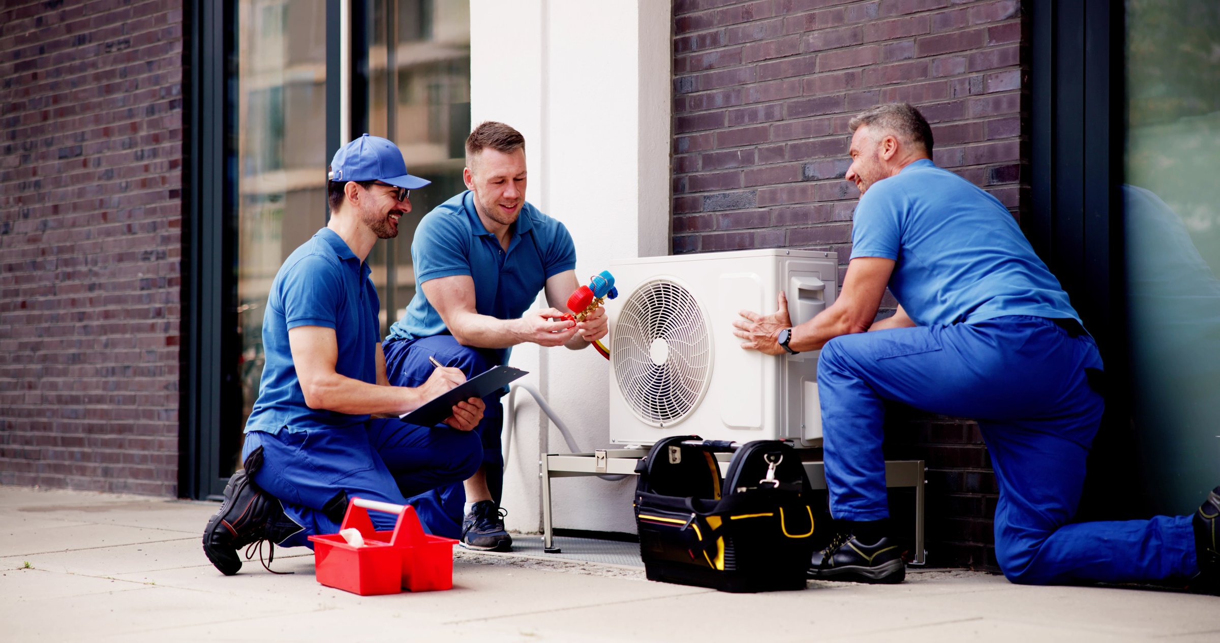 Experienced HVAC Technician Ensuring Quality Air Conditioning Installation for Commercial Buildings, Providing Safe and Efficient Cooling Systems.
